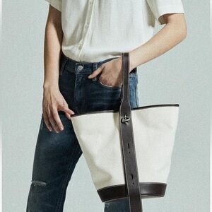Canvas bucket bag with leather accent in camel